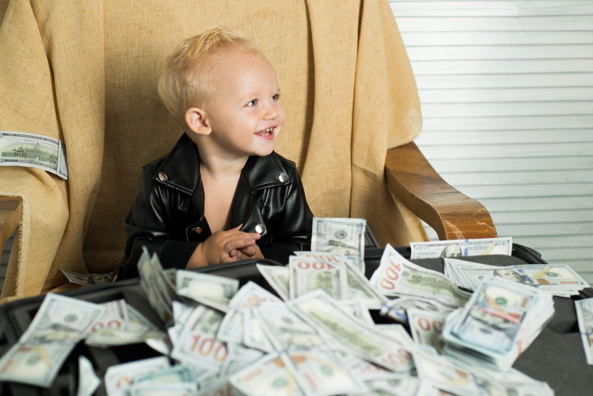 Money obsession. Little boy count money in cash. Small child do business accounting in startup company. Startup business costs. Little entrepreneur work in office. Boy child with money case.