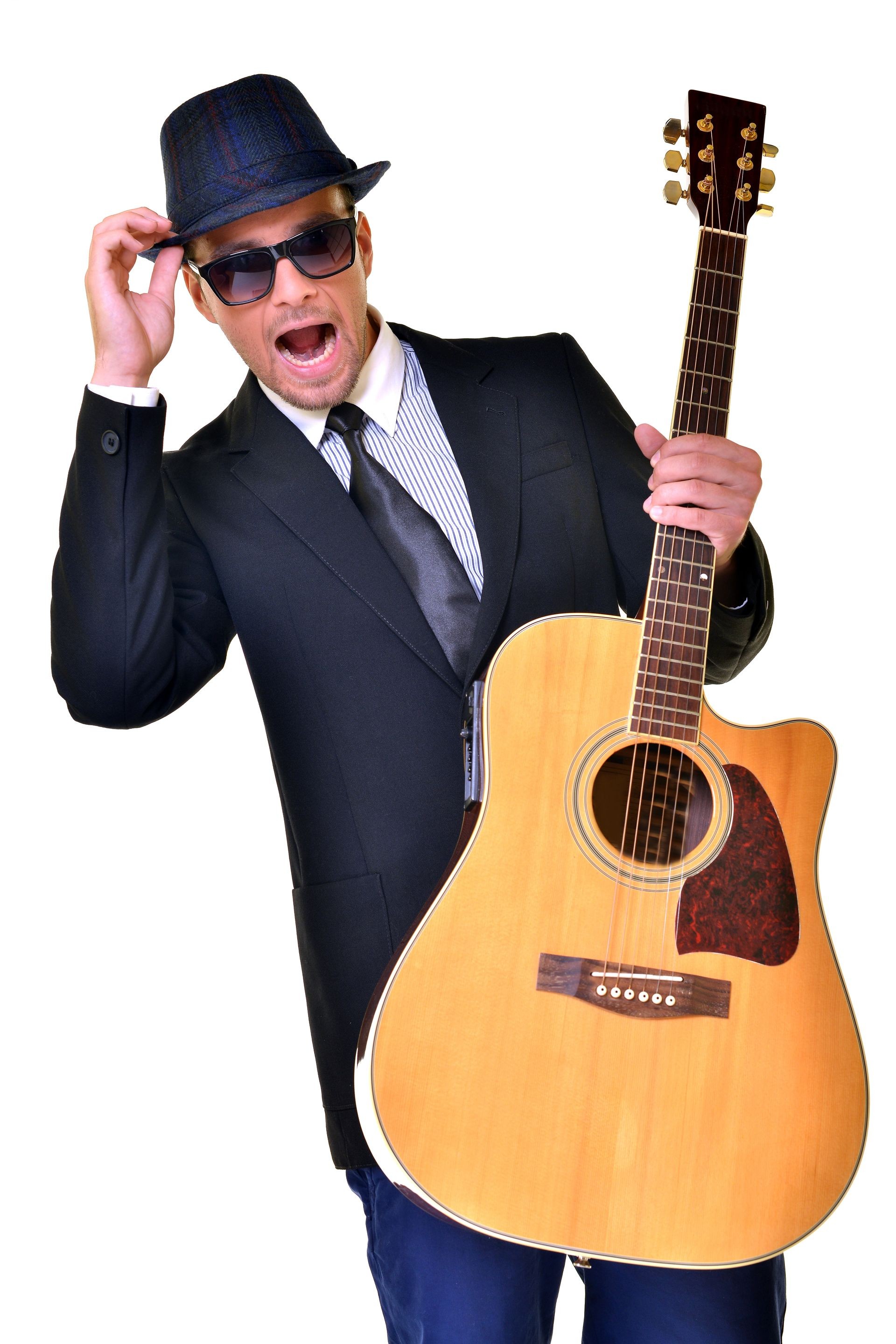  happy man with guitar over white background